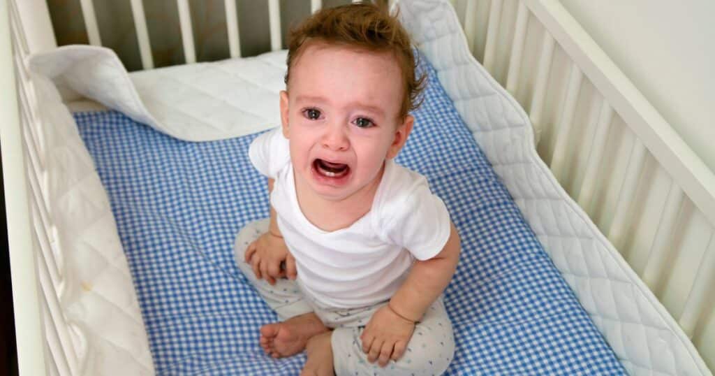 baby crying in cot
